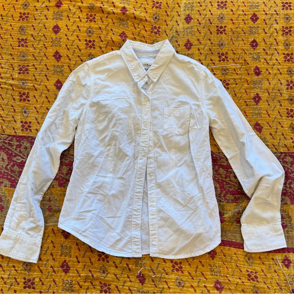 White long sleeved button up collared shirt. 100% cotton. Size M.